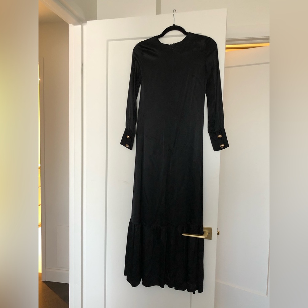 Black satin formal maxi dress with gold buttons and tiered bottom.